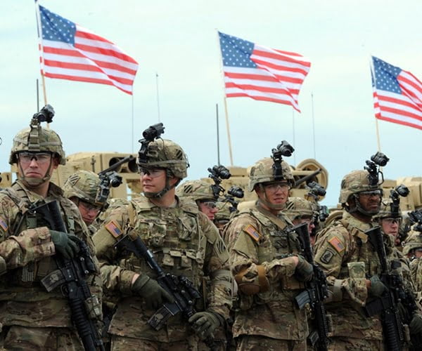 Soldiers of the US mechanized infantry company from the 1st Brigade, 3rd Infantry Division look on during an official opening ceremony of the joint U.S.-Georgian exercises Noble Partner 2015 at the Vaziani training ground outside Tbilisi on May 11, 2015. AFP PHOTO / VANO SHLAMOV (Photo credit should read VANO SHLAMOV/AFP/Getty Images)